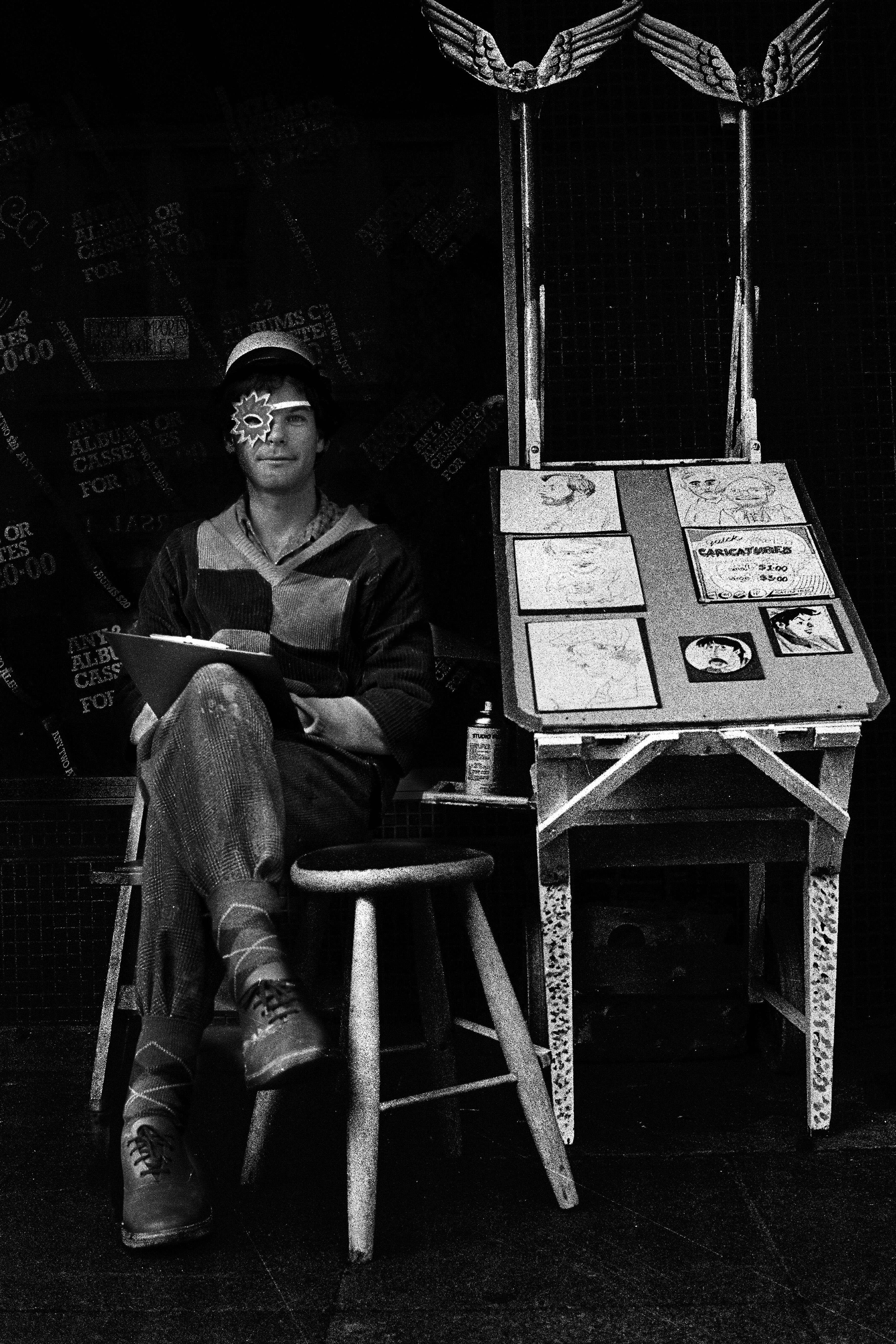 Gerard sitting beside a finished collection of illustrated stories