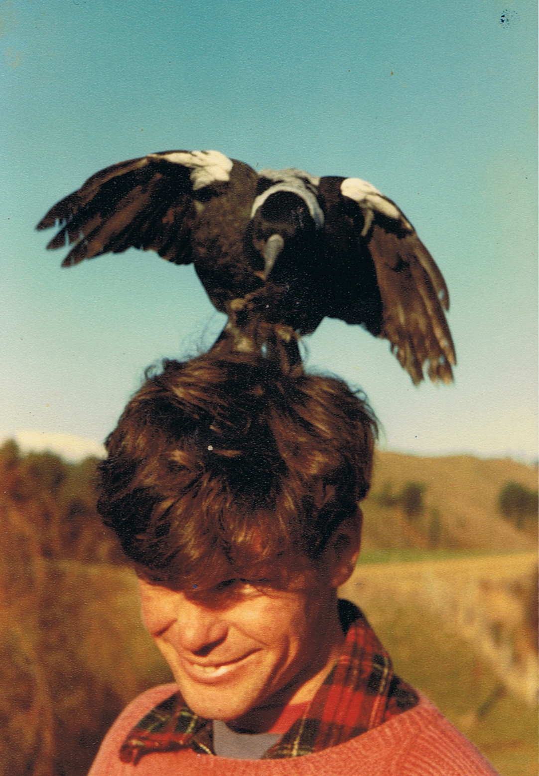 A photo of Gerard with a bird on his head