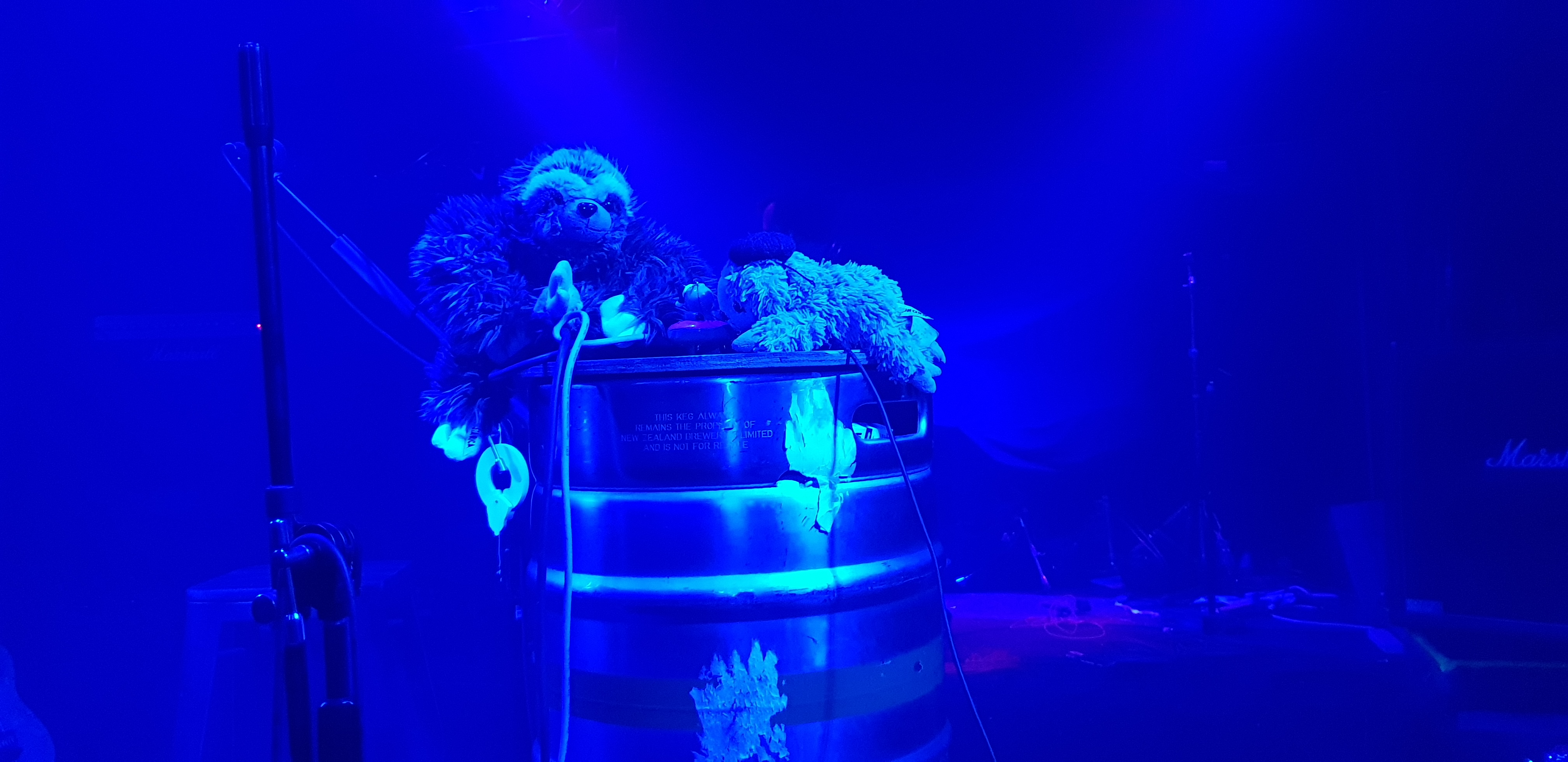 soft tow sloths on a forty gallon drum, on a blue lit stage