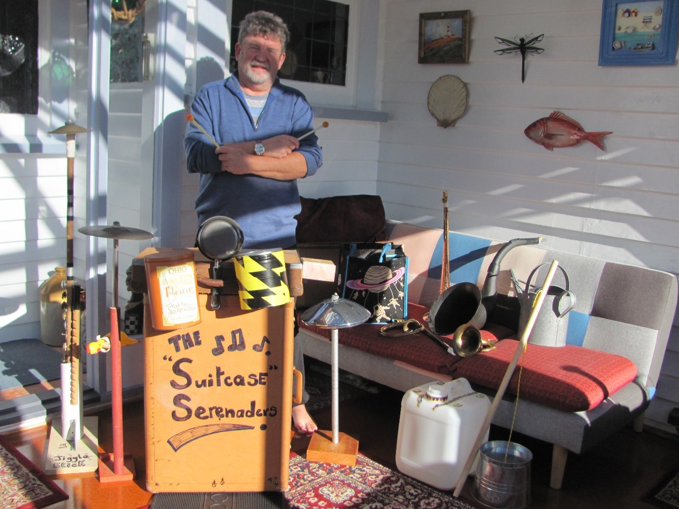 Mike with a range of his inventions, including a suitcase drum kit and multiple percussion instruments, a washtub bass, and various kazoo-modified wind and brass instruments