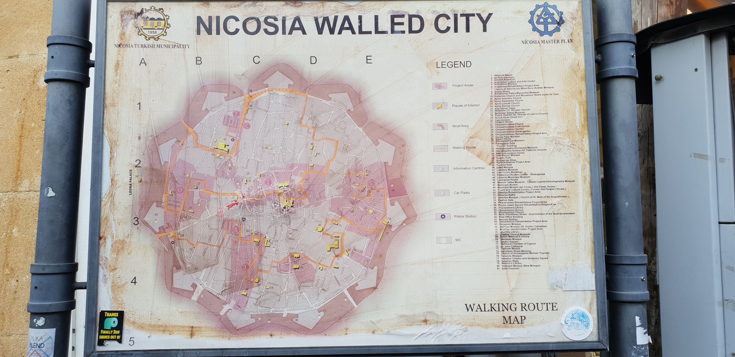 a poster map of Nicosia on a billboard