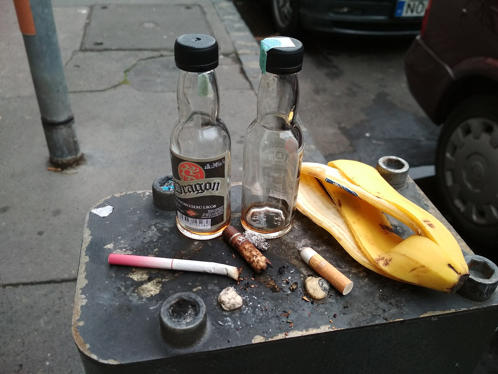 old bottles and cigarettes with a banana peel