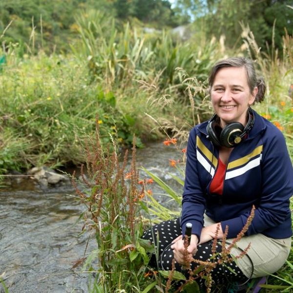 Kedron Parker beside a stream.