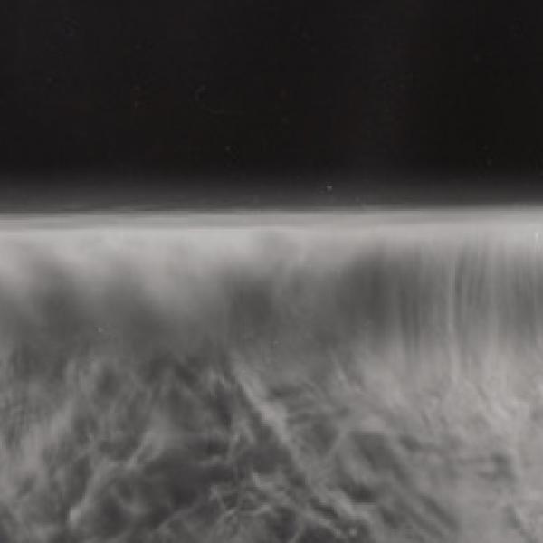 A grey and blurred image. It is difficult to tell if it is a vast landscape, or a small surface magnified