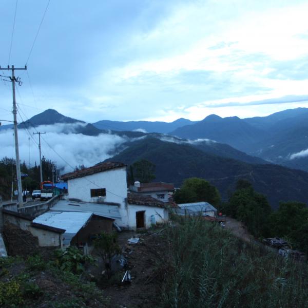 Early morning mist over a hillside village in Sierra Juárez
