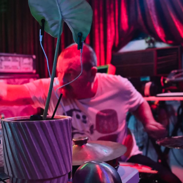 Kieran Monaghan playing drums