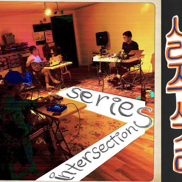A group of performers in a semi circle. Things are confortably messy. The wooden floor is warm. Text: Series Intersections, and some korean text.