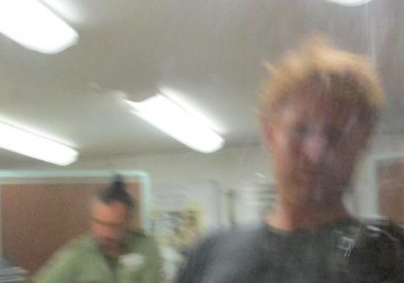 a blurred photo of Riki and Dan in the studio