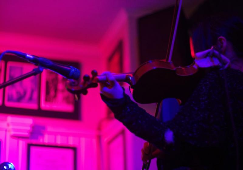 Motoko playing her violin