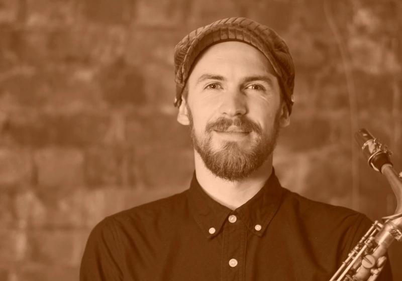 Jake Baxendale portrait with a saxophone