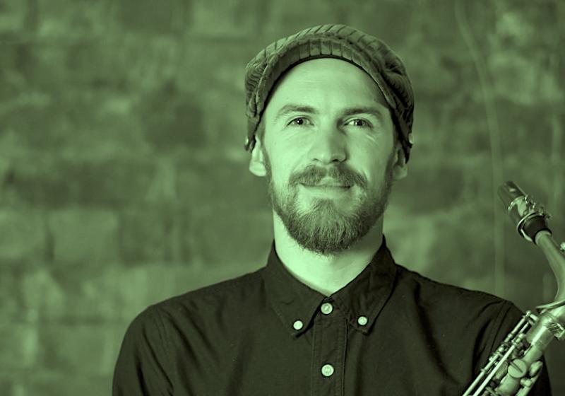 Jake Baxendale portrait with a saxophone