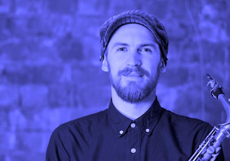 Jake Baxendale portrait with a saxophone