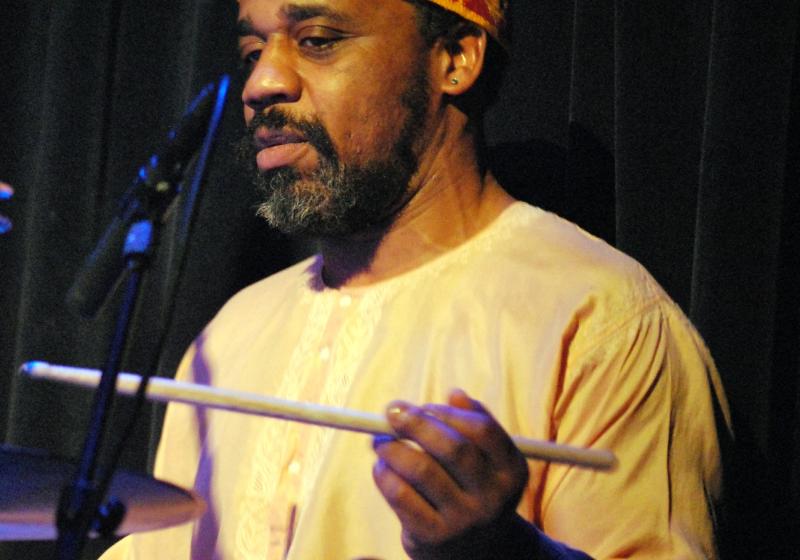 a colour photo of Pheeroan playing drums