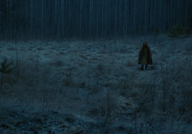 Anna Fält stands in a Nordic forrest in winter