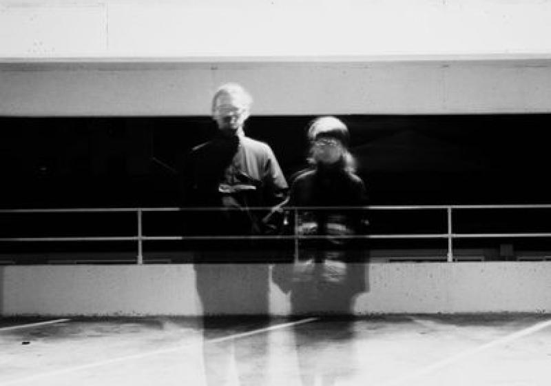 Matt and Sophie of Integument stand side by side in a black and white photo