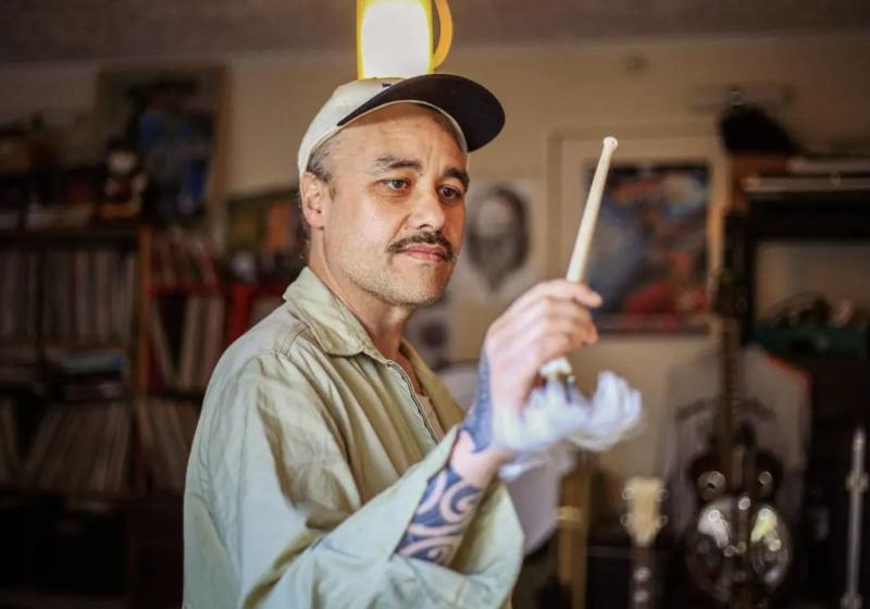 A photo of Riki Pirihi holding a drum stick 