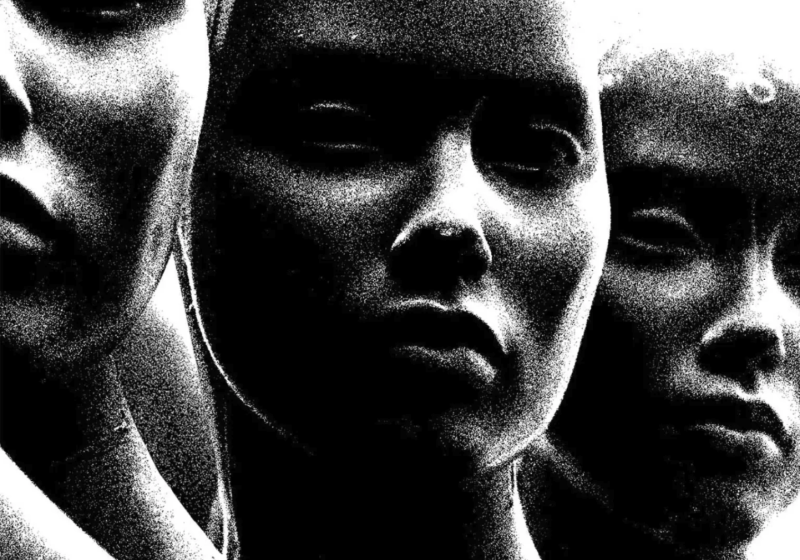3 ominous black and white heads layered next to each other