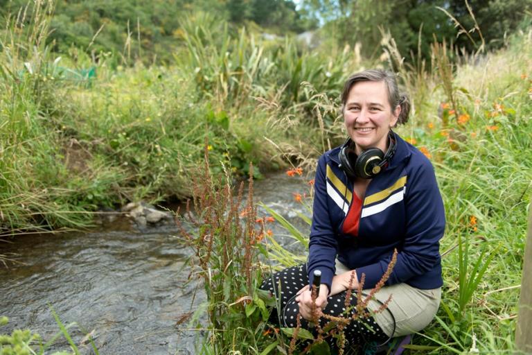 Kedron Parker beside a stream.