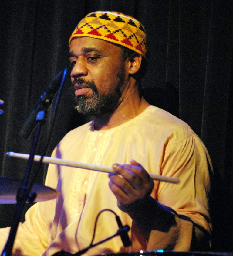 a colour photo of Pheeroan playing drums