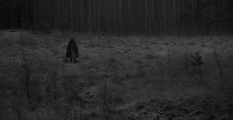 Anna Fält stands in a Nordic forrest in winter