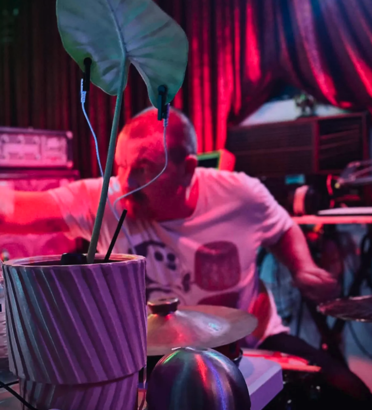Kieran Monaghan playing drums