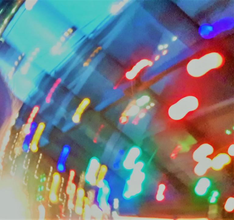 a swirl of city lights creating an abstract rainbow.